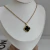 Collar Trébol Cristal Negro M | Acero Dorado - comprar online