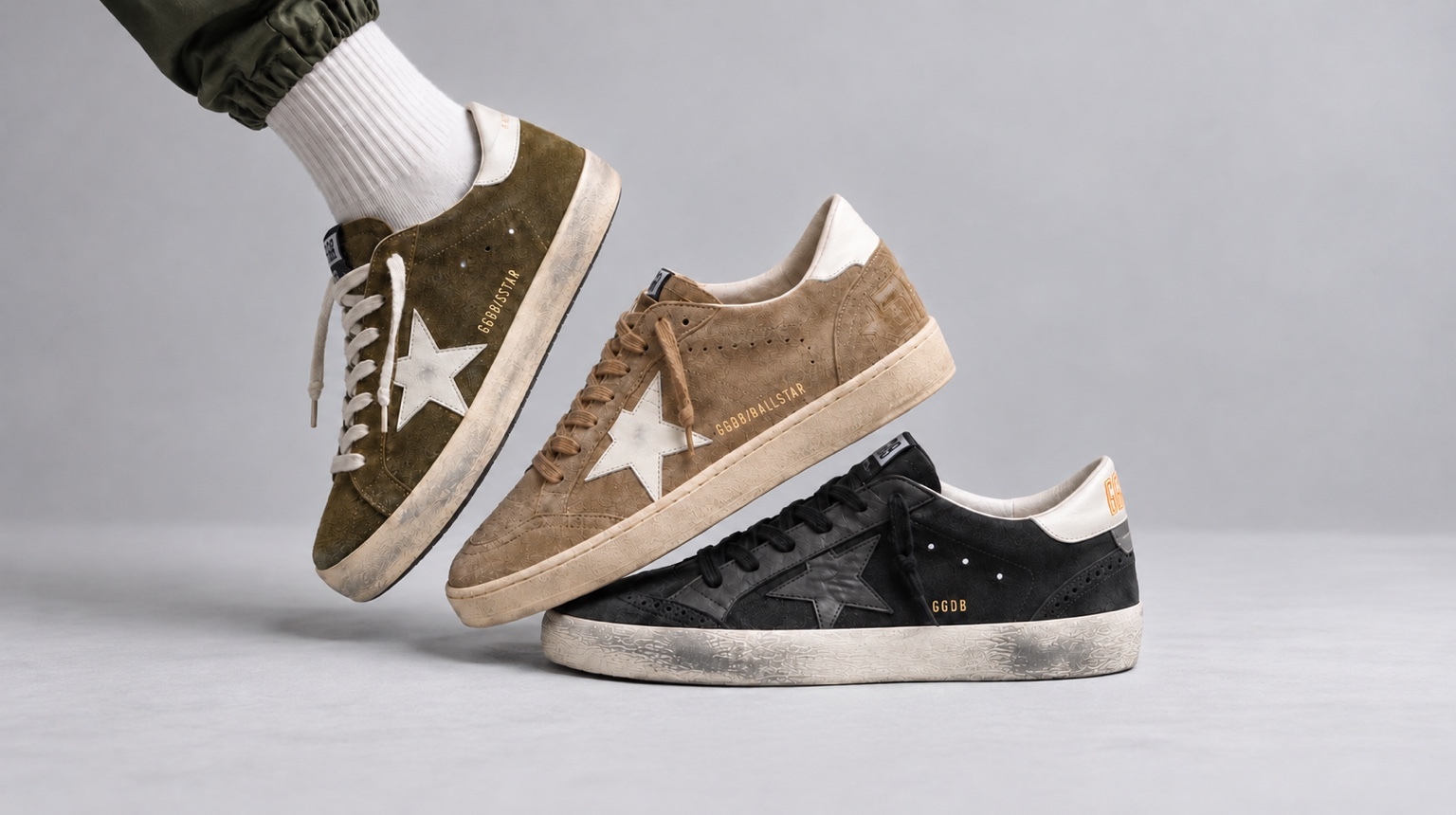 Tres tenis Golden Goose en verde, beige y negro
