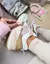 TÊNIS NB 990 ROSE MARROM FEMININO na internet
