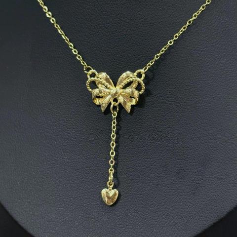 cadenita con dije de moño con corazón colgando de acero