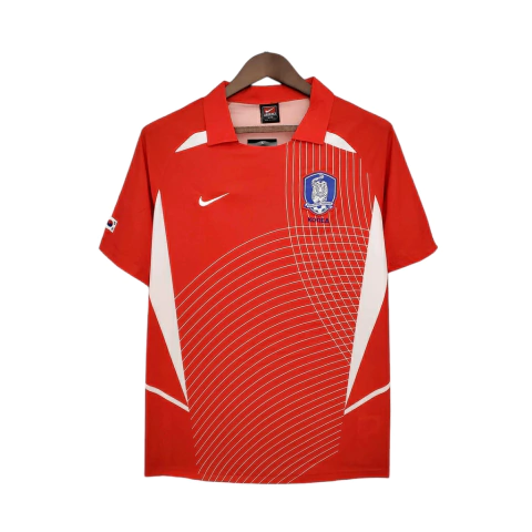 Camisa retrô da Coreia do Sul 2002 na cor vermelha com detalhes brancos, logo da Nike e escudo da seleção