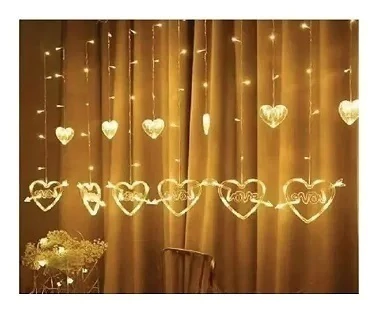 Cascata com 138 LEDs Branco quente com corações na ponta 8 funções tomada macho e fêmea 2.5 metros 127V. - comprar online
