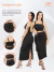 Mulher usando conjunto alfaiataria Lara preto com cropped de alças e saia midi com amarração frontal