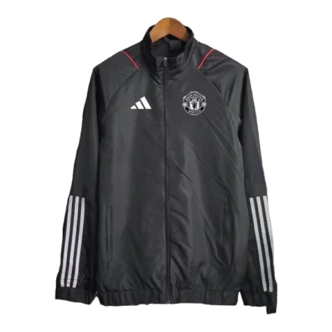 Jaqueta Corta-Vento Manchester United 23/24 - Masculina Adidas - Preta com detalhes em vermelho e branco