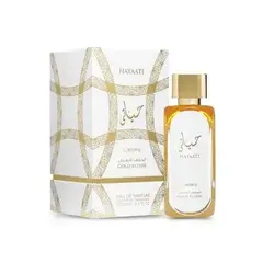 Perfume compartilhável Lattafa Hayaati Gold Elixir Eau de Parfum 100 ml com frasco transparente, líquido âmbar, tampa dourada e embalagem clara com detalhes geométricos dourados.