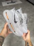 Tênis Nike Vomero Premium - Cinza/Laranja (iMPORTADO)