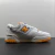 New Balance 550 White Vibrant Orange en internet