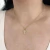 Colar Cruz Cravejada em Zirconia Banhado a Ouro - comprar online