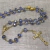 Terço Cristal Aust. Azul Claro 8X6Mm - P.N. Dourado - Folh. Ouro - comprar online