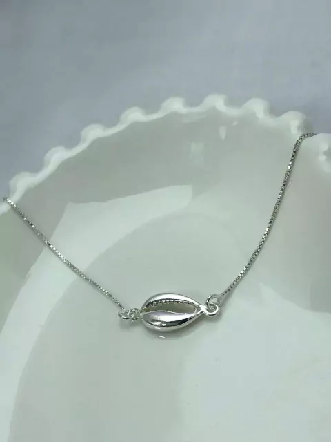 Pulseira Minimalista com pingente de Búzios