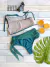 Conjunto de bikini Coulotte Berenice  en tonos verde y nude, con accesorios como lentes de sol y cítricos.