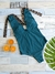 Traje de baño entero en color verde con lazos de estampado de leopardo, acompañado de naranjas y una hoja verde.  Ideal para curvas y busto grande.