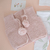 Chaleco de lana rosa bebe