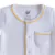Macacão Bebê Jacquard Branco com detalhe Amarelo - comprar online