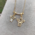 Colar Canga Com Menino e Anjo de Zirconias Folheado A Ouro 18k - comprar online