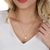 Colar Pingente Flor Com Pérola Shell Folheado A Ouro 18k - Drusi | Loja de Semijoias - Coleções de Colares Femininos, Brincos