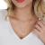 Colar Pingente Flor Com Pérola Shell Folheado A Ouro 18k - Drusi | Loja de Semijoias - Coleções de Colares Femininos, Brincos