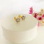 Brinco Infantil Flor Pétalas Lilás Folheado A Ouro 18k