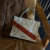 Cartera/ Bandolera Azalea Gris volado ladrillo - comprar online