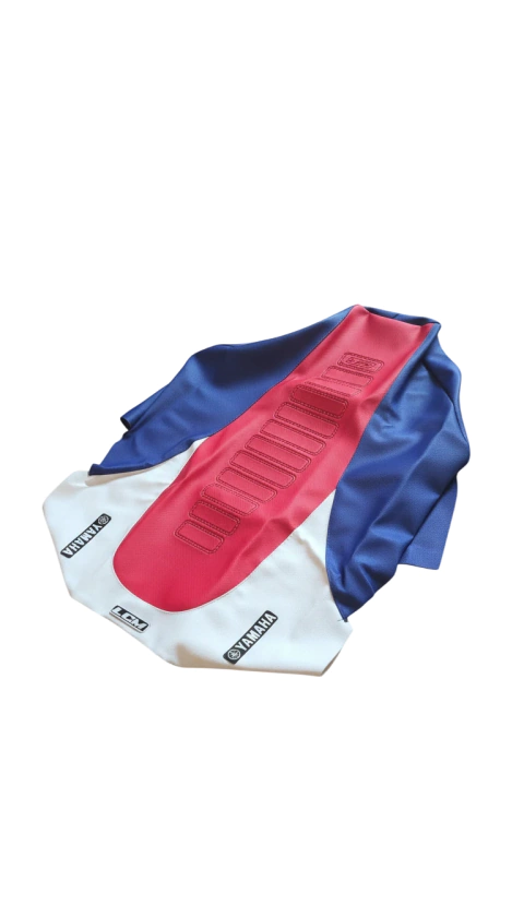 Funda de asiento Ultragrip para Yamaha Banshee 350 en colores azul, rojo y blanco con logos de Yamaha y LCM