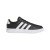 Zapatillas Adidas Breaknet 2.0 en color negro con detalles en blanco y suela blanca, vista lateral.