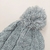 GORRO POMPON TEJIDO GRIS en internet