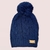 GORRO POMPON TEJIDO AZUL MARINO