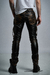 Distressed leather biker pants with quilted knee padding. Modern cut and slim fit. Unique piece, hand-finished using FRANCUIR's exclusive corrosive artisanal process.