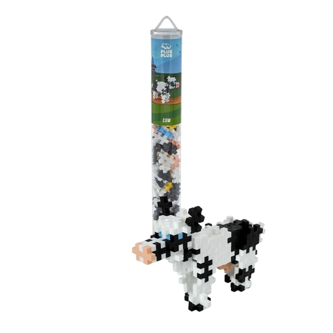 Puzzle 3D de vaca armado con piezas Plus Plus en colores blanco, negro y rosa