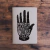 cuaderno mano gris