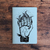 cuaderno mano fuego celeste