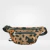 Riñonera Venecia de simil neoprene con diseño animal print en tonos marrones y negros, ideal para el verano.