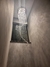 Lustre de cristal pendente em formato espiral instalado em um ambiente moderno com paredes de concreto. Luminaria de Teto Lustres Gênesis loja online de Lustres e Iluminação Decorativa