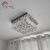 Lustre Plafon de Cristal Harion Quadrado 60x60 instalado no teto de uma sala de estar. Lustres Gênesis loja online de Lustres e Iluminação Decorativa. 