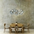 Lustre Pendente Moderno Halo Dourado instalado em sala de jantar com mesa de madeira e cadeiras. Lustres Gênesis Site online venda de Lustres e Iluminação decorativa