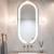 Espelho Moderno Touch Screen Oval 75x50 com LED instalado em banheiro elegante. Lustres Genesis loja online de Lustres e Iluminação Decorativa