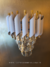 Luminária de parede preta com detalhes em cristal da marca Sindora, modelo Líbia, ideal para decoração de cabeceira de cama, corredor, quartos e lavabos. Lustres Gênesis loja online venda de Lustres e Iluminação