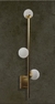 Arandela Moderna Tripla com Globos Leitosos em parede de concreto Lustres Gênesis loja online de Lustres e Iluminação Decorativa