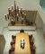 Lustre pendente moderna Rudá com 12 braços sobre mesa de jantar em ambiente sofisticado. Lustres Gênesis loja online de Lustres e Iluminação Decorativa