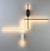 Arandela Moderna Cross Branca e Preta montada na parede com design minimalista iluminado Lustres Gênesis Site online venda de Lustres e Iluminação decorativa