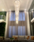Luxuoso lustre de cristal em uma sala de estar moderna com pé direito duplo e cortinas altas, Luminaria de Teto,  Cristal Legitimos Lustres Gênesis loja online de Lustres e Iluminação Decorativa