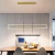 Lustre pendente de LED moderno nórdico dourado em sala de jantar elegante Lustres Gênesis Site online venda de Lustres e Iluminação Decorativa