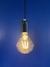 Lâmpada de Filamento de Led D95 4W Squirrel Cage pendurada com fundo azul Lustres Gênesis loja online de Lustres e Iluminação Decorativa