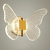 Arandela moderna em formato de borboleta com iluminação LED, ideal para quartos e lavabos. Lustres Gênesis loja online de Lustres e Iluminação Decorativa