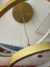 Pendente lustre luminária de teto com 3 aros em LED dourado, visto de baixo para cima Detalhe do Pendente da Canopla Dourada com dispositivos. Lustres Gênesis loja online venda de Lustres e Iluminação