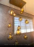 Lustre Pendente Sarvah com 12 globos transparentes iluminados, ideal para casas com pé direito duplo. Lustres Gênesis loja online de Lustres e Iluminação Decorativa