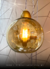 Lustre Pendente Sarvah com globo conhaque iluminado, design moderno para pé direito alto. Lustres Gênesis Site online venda de Lustres e Iluminação