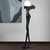 Escultura Equilibrista Preta com Globo Fosco em ambiente interno Lustres Genesis loja online de Lustres e Iluminação Decorativa