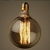 Lâmpada de Filamento de Carbono G125 40W estilo Squirrel Cage da GMH Lustres Gênesis loja online de Lustres e Iluminação Decorativa