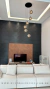 Lustre Pendente Sarvah Moderno com 6 globos fumê espelhados em sala de estar moderna. Lustres Gênesis loja online de Lustres e Iluminação Decorativa